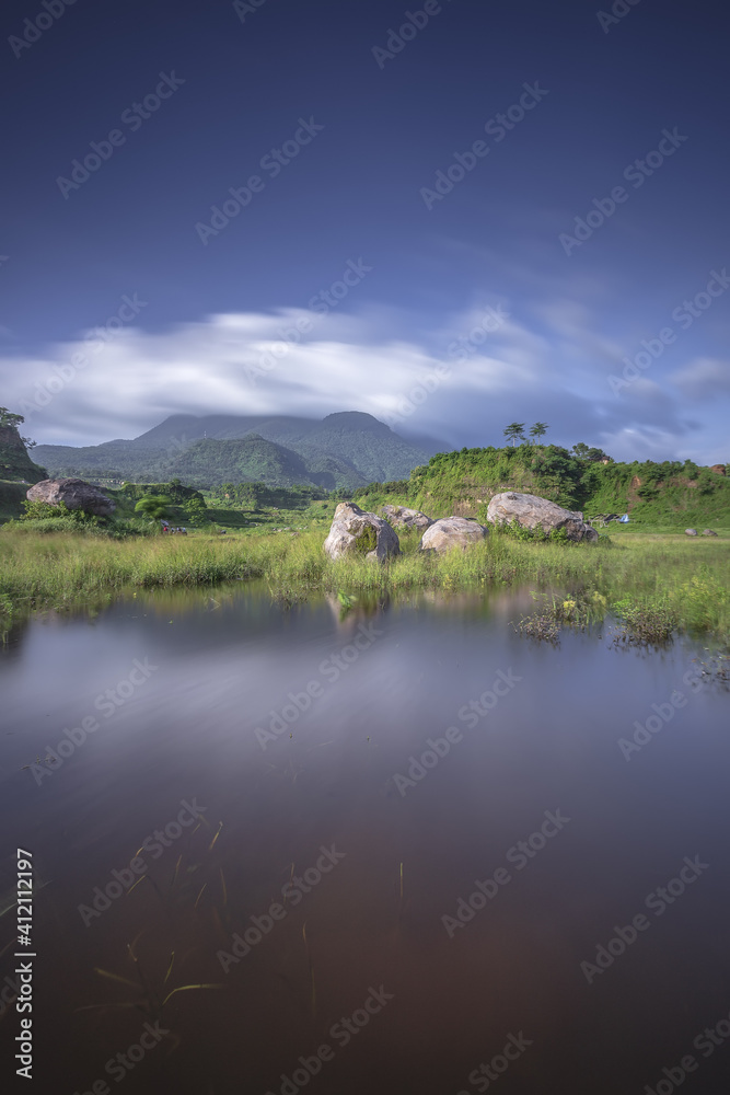 Ranu Manduro of Indonesia with Penanggungan Mountain Reflection. Early Morning