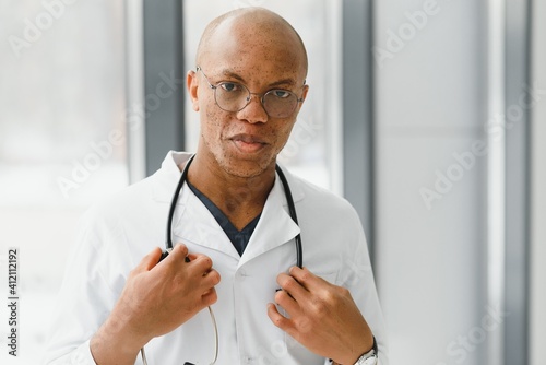 African American man male hospital doctor in white coat with stethoscope