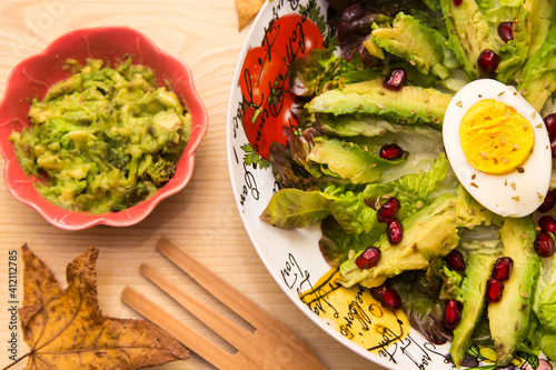 avocado salad with vegetables and egg photo