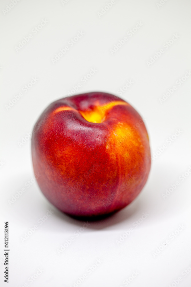 Fresh ripe nectarines, peach fruit, isolated in white Fresh ripe nectarines, peach fruit, isolated in white
