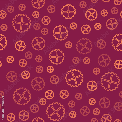 Brown line Bicycle sprocket crank icon isolated seamless pattern on red background. Vector.