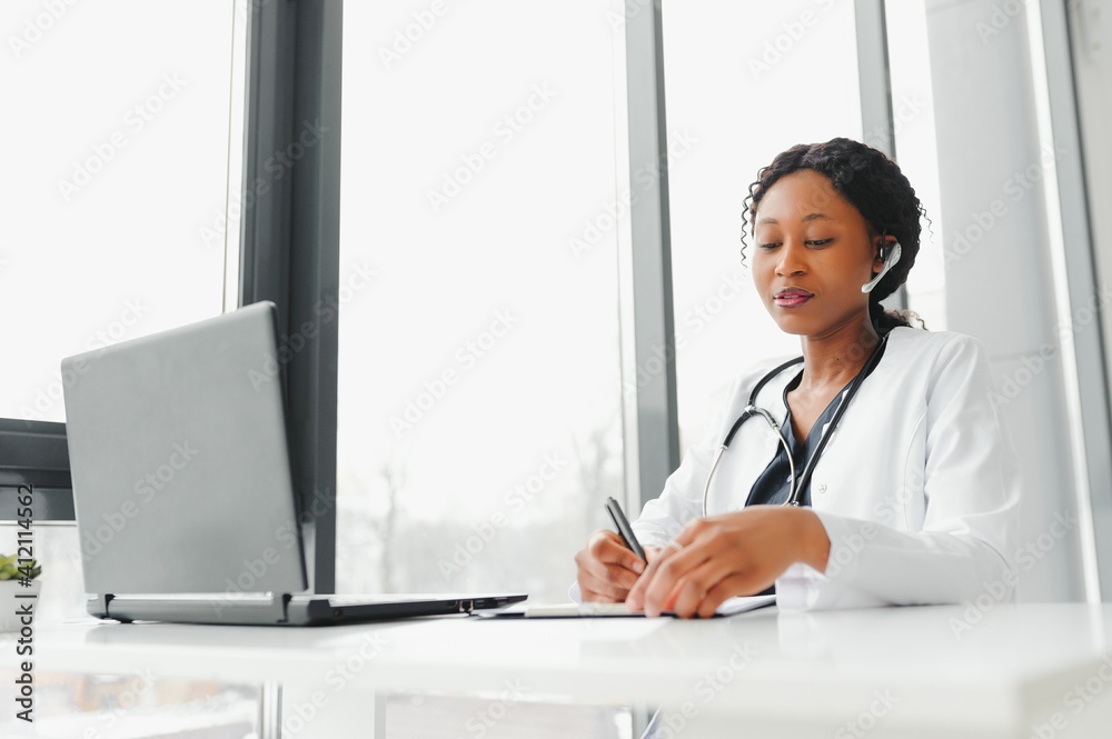 Telehealth, African American doctor in headset consulting with the patient over the phone call. Health care call center and telehealth online concept