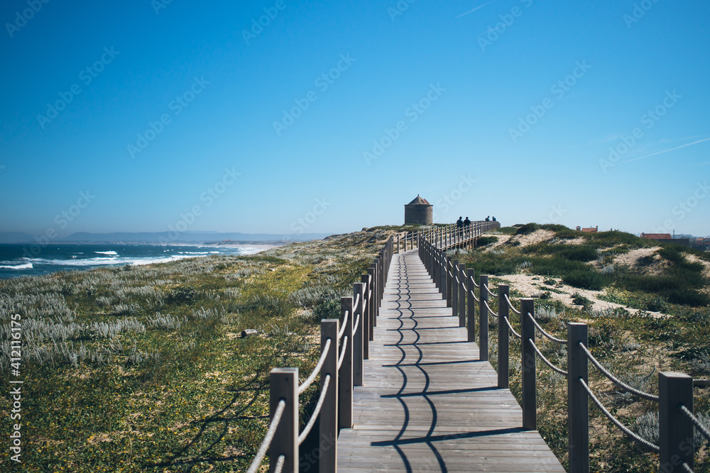 wooden path along sea in portugal