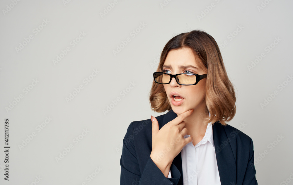 A business woman in a classic suit gestures with her hands Copy Space emotions A business woman in a classic suit gestures with her hands Copy Space emotions