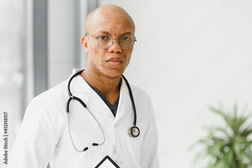 African American man male hospital doctor in white coat with stethoscope African American man male hospital doctor in white coat with stethoscope