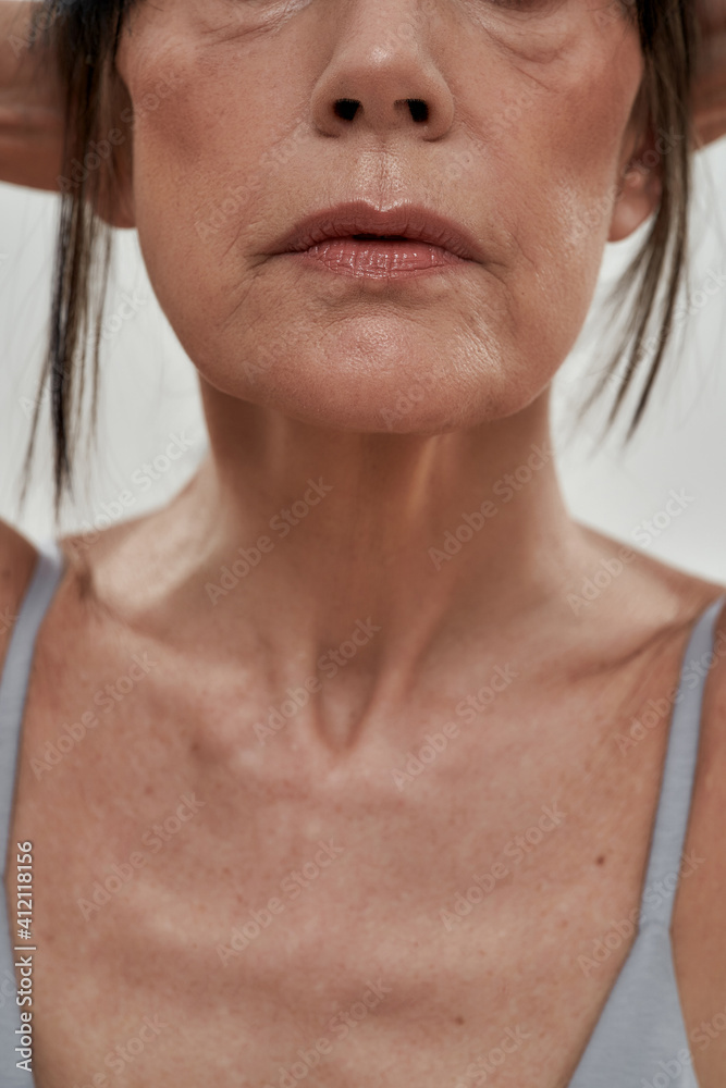 Selective focus on chin of middle aged caucasian woman Selective focus on chin of middle aged caucasian woman