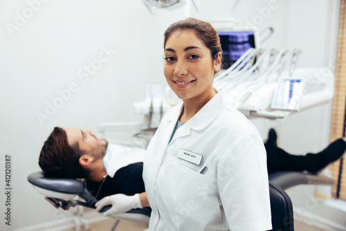 Confident female dentist in her clinic