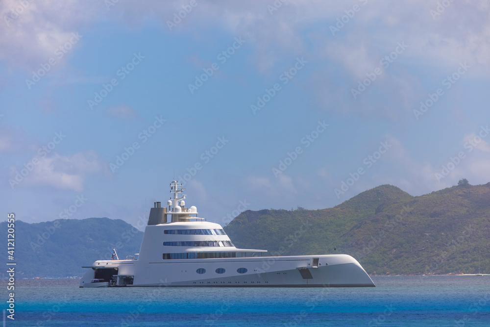 Expensive stealth luxury super yacht moored off Curieuse island in the Seychelles