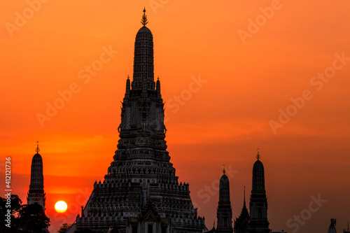 Blurred abstract background of the pagoda scenery of Wat Arun on the Chao Phraya River in Bangkok of Thailand  the silhouette  the light hitting the sculpture  has a kind of artistic beauty.
