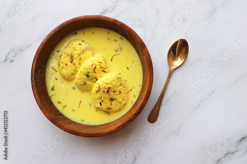 Rasmalai, Rossomalai, Roshmolai, Rasamalei is a very popular Indian dessert. It's a Similar dish to Rasgulla. It is a sweet delicacy made with Indian cottage cheese or chenna. Copy space. photo