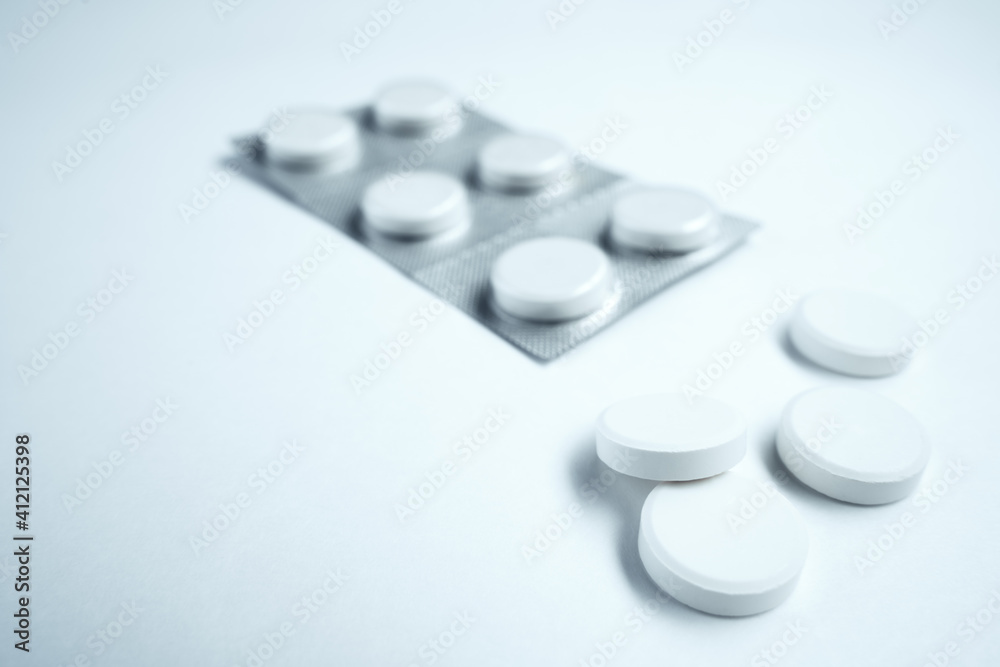 white pills are packed in an aluminum foil blister.