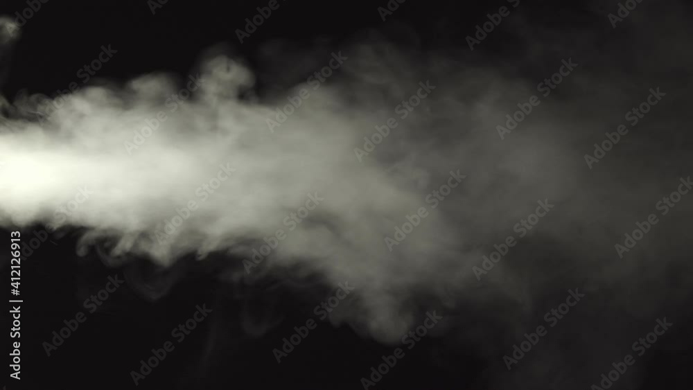 White steam from water on a black background directed to the right White steam from water on a black background directed to the right