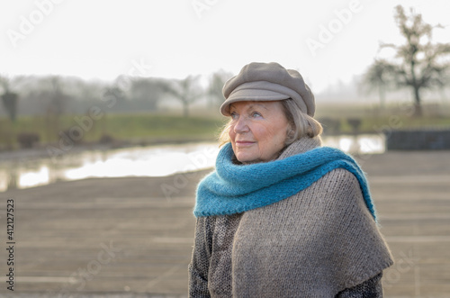 Chic senior woman in a winter beret and scarf © michaelheim