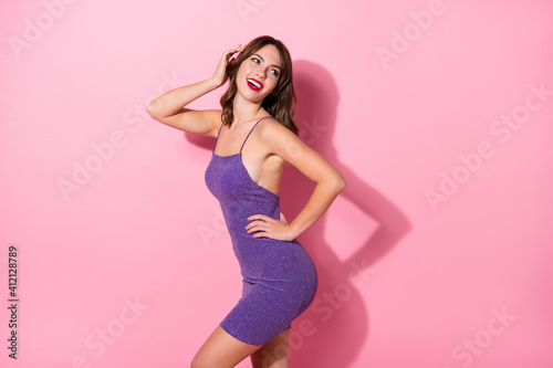 Profile side photo of attractive happy young lady hold hand head waist look empty space isolated on pink color background
