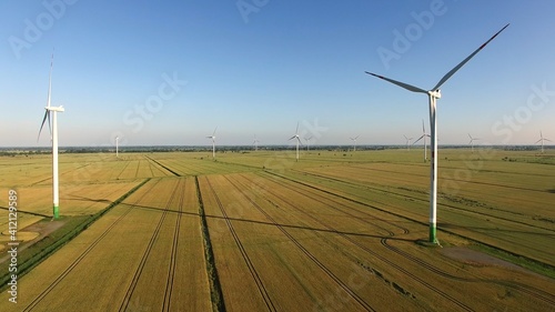 Aerial of Wind Power Station Turbines On Wheat Fields