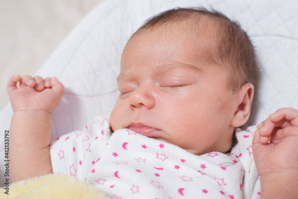 Cute, small and adorable newborn baby girl sleeping Cute, small and adorable newborn baby girl sleeping