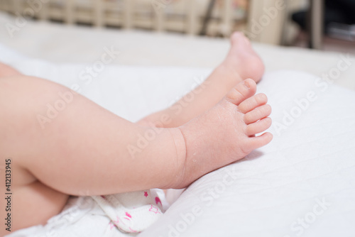 Little foot of a cute, adorable newborn girl