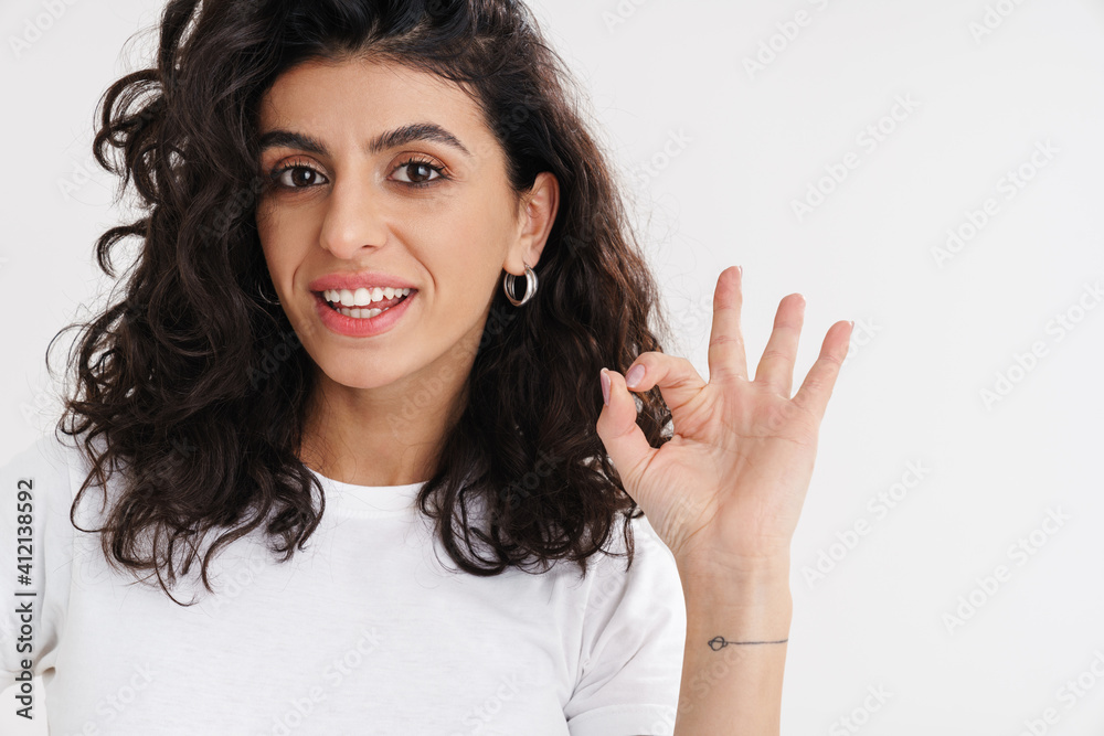 Happy beautiful brunette girl smiling and showing ok sign Happy beautiful brunette girl smiling and showing ok sign