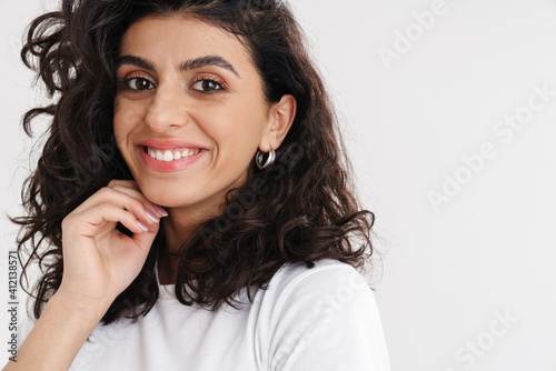 Happy beautiful brunette girl smiling and looking at camera