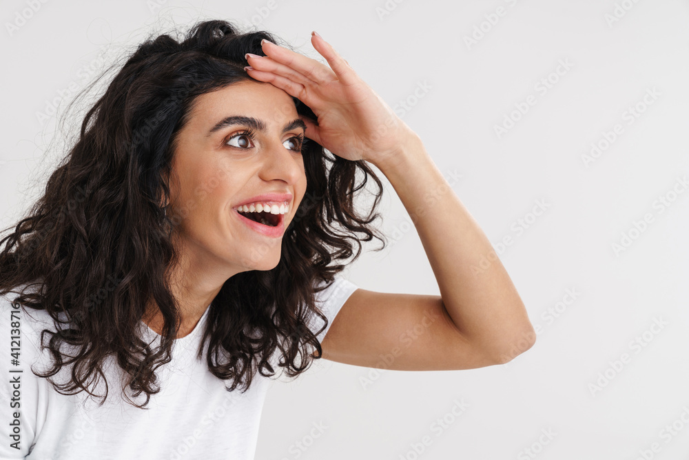 Excited beautiful brunette girl smiling and looking aside Excited beautiful brunette girl smiling and looking aside