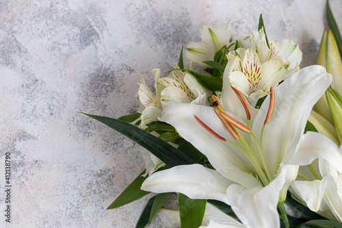 Fototapeta Naklejka Na Ścianę i Meble -  A bouquet of lilies on a light background. Mother's Day, Women's Day, Valentine's Day or Birthday.