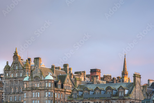Sunset or sunrise cityscape view of the Edinburgh skyline and old town tenement buildings off the Royal Mile in the capital city of Scotland, UK.