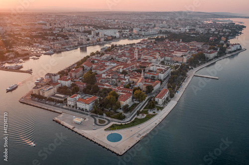 Aerial drone shot of Zadar old town with sea organ during sunrise hour in Croatia Dalmatia area