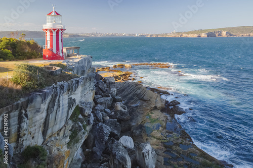 The red and white Hornby Lighthouse on a sunny summer day along the coastline in the Watsons Bay suburb of Sydney, NSW, Australia. photo