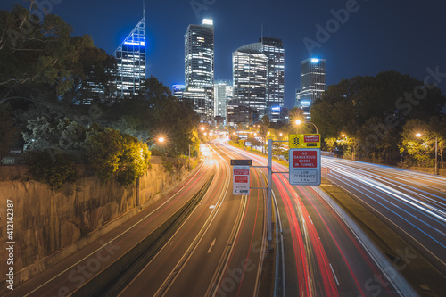 Summer night cityscape view of the M1 motorway and Eastern Distributor and downtown Sydney central business district (CBD) city skyline from Art Gallery Rd. in NSW.