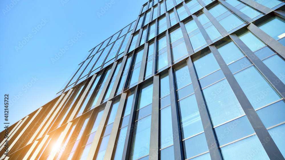 Fototapeta premium Downtown corporate business district architecture. Glass reflective office buildings against blue sky and sun light. Economy, finances, business activity concept.