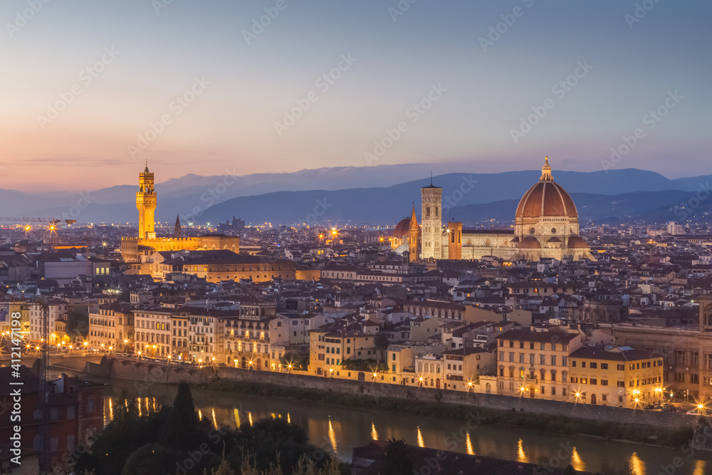 A post sunset or sunrise night view of old town Florence cityscape skyline, the River Arno, Palazzo Vecchio and Cathedral of Santa Maria del Fiore (il duomo) from Piazzale Michelangelo.