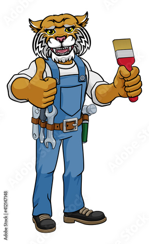 A wildcat painter decorator cartoon animal mascot holding a paintbrush and giving a thumbs up