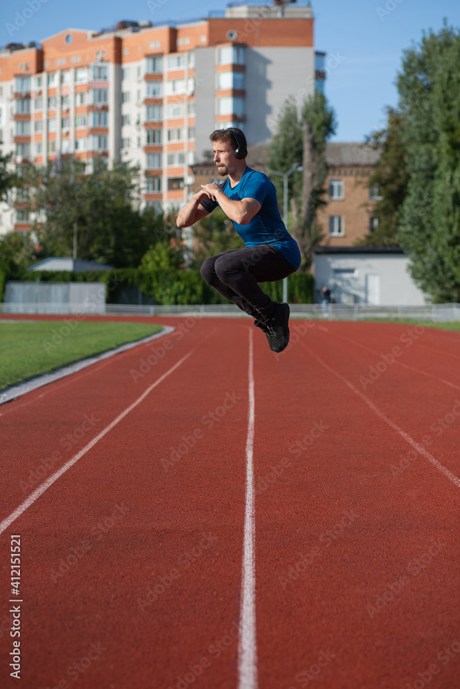 Active man jumping outdoor during workout