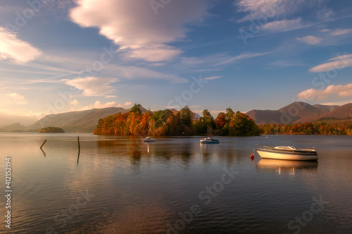 Autumn lake with boats
