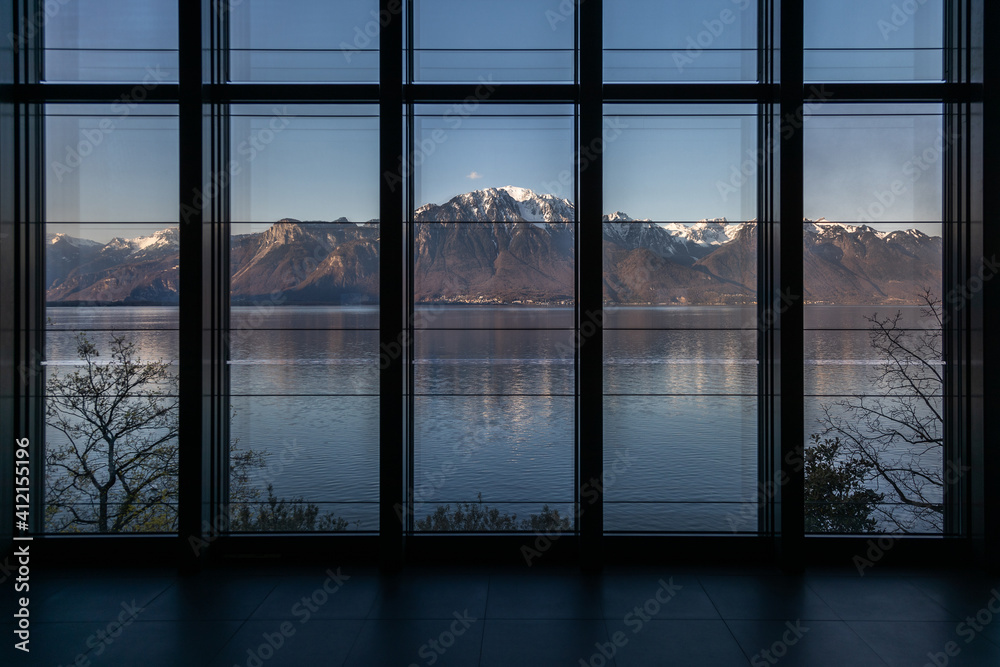 View of snow-capped mountains across Lake Geneva. View of snow-capped mountains across Lake Geneva.