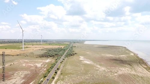 view from the air on the steppe and air windmills alternative energy
