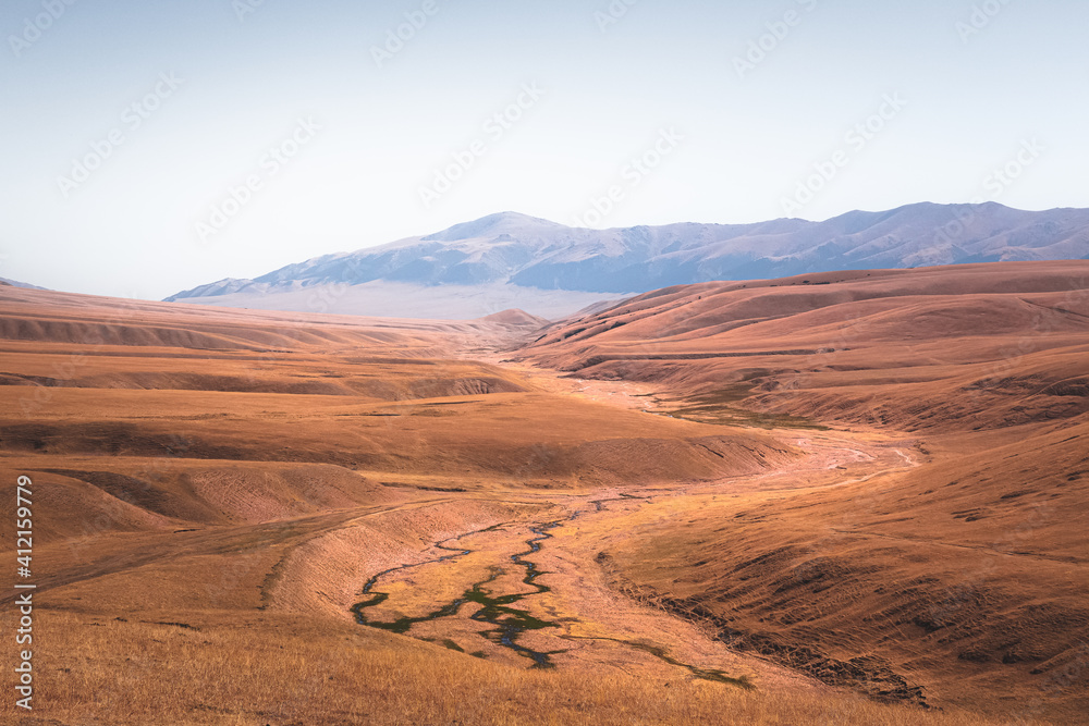 Sweeping vista landscape of the Assy Plateau, a large mountain steppe valley and summer pasture 100km from Almaty, Kazakhstan.