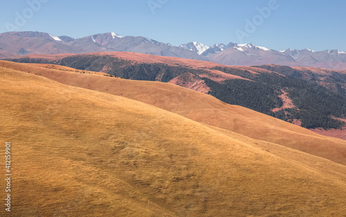 Sweeping vista landscape of the Assy Plateau, a large mountain steppe valley and summer pasture 100km from Almaty, Kazakhstan. photo