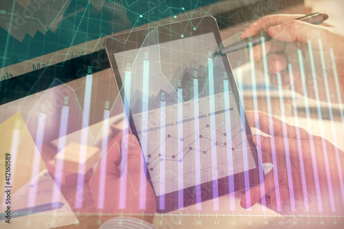 Wallpaper Mural Double exposure of man's hands holding and using a phone and financial chart drawing. Market analysis concept. Torontodigital.ca