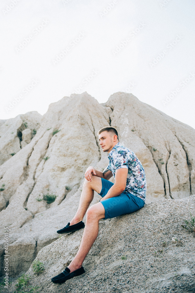 guy in a light shirt in a granite quarry
