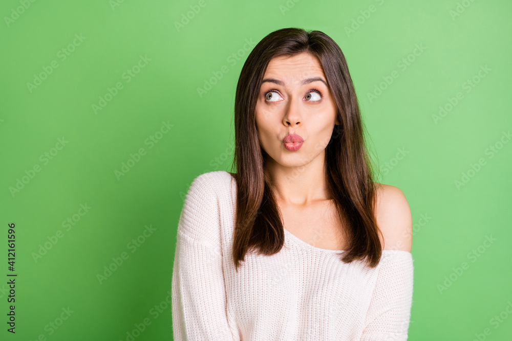 Photo of young beautiful pretty lovely sweet cute girl pout lips look copyspace isolated on green color background Photo of young beautiful pretty lovely sweet cute girl pout lips look copyspace isolated on green color background