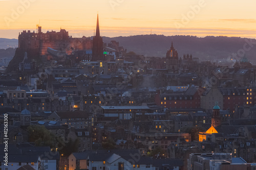 A view of Edinburgh Castle and Edinburgh s old town cityscape skyline at sunset or sunrise from Salisbury Crags.