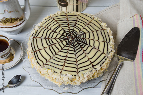 Delicious festive esterhazy cake with tea on a light background top view close-up photo