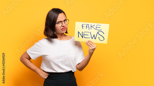 Obraz na plátne young pretty woman. fake news concept