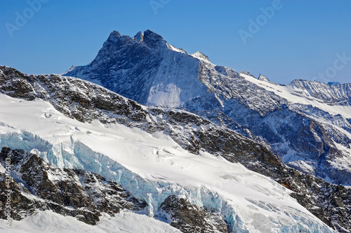 Mountain peaks and glaciers in the Swiss Alps in the Grindelwald region.