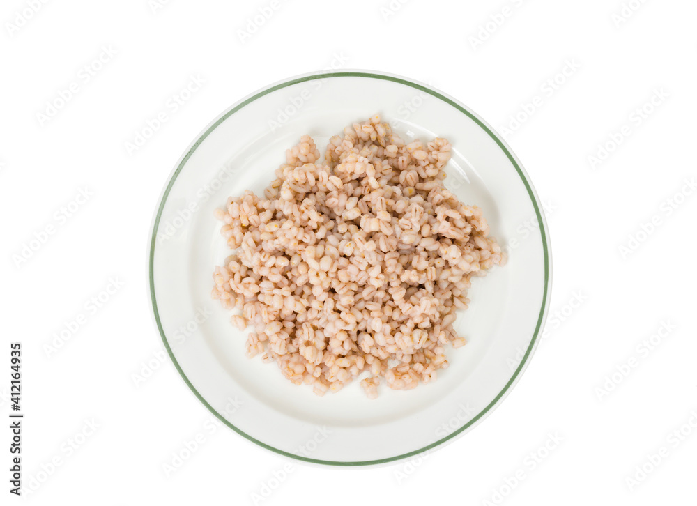 Porridge, boiled pearl barley on plate on white background