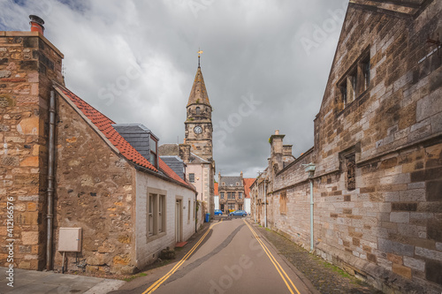 Obraz na plátně The quaint traditional village of Falkland, a popular filming location in Fife, Scotland on a sunny summer day