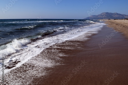 A wave on the shore of a sandy seashore. Patara Beach