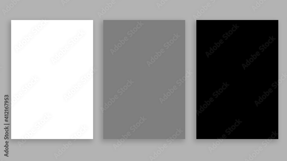 Three blank sheets on a gray background. White, gray, black.