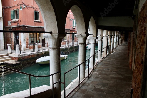 A portico on a canal in Venice photo